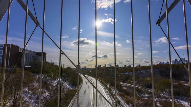 Timelapse over the busy Don Valley Parkway from the Bloor Street Viaduct in Toronto on a crisp, snowy Canada Day