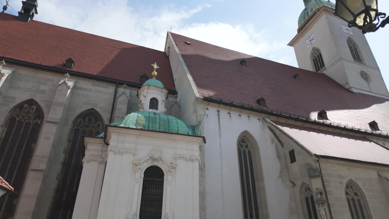 St. Martin's Cathedral in Bratislava with Gothic architecture under a bright blue sky