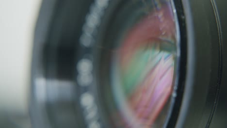 macro shot of a lens reflecting a display with movement