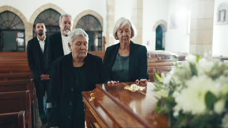 senior women, coffin and funeral in church