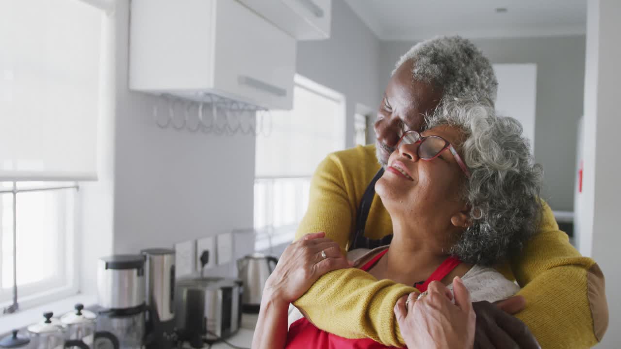 A senior African american couple dancing at home. Social distancing in quarantine