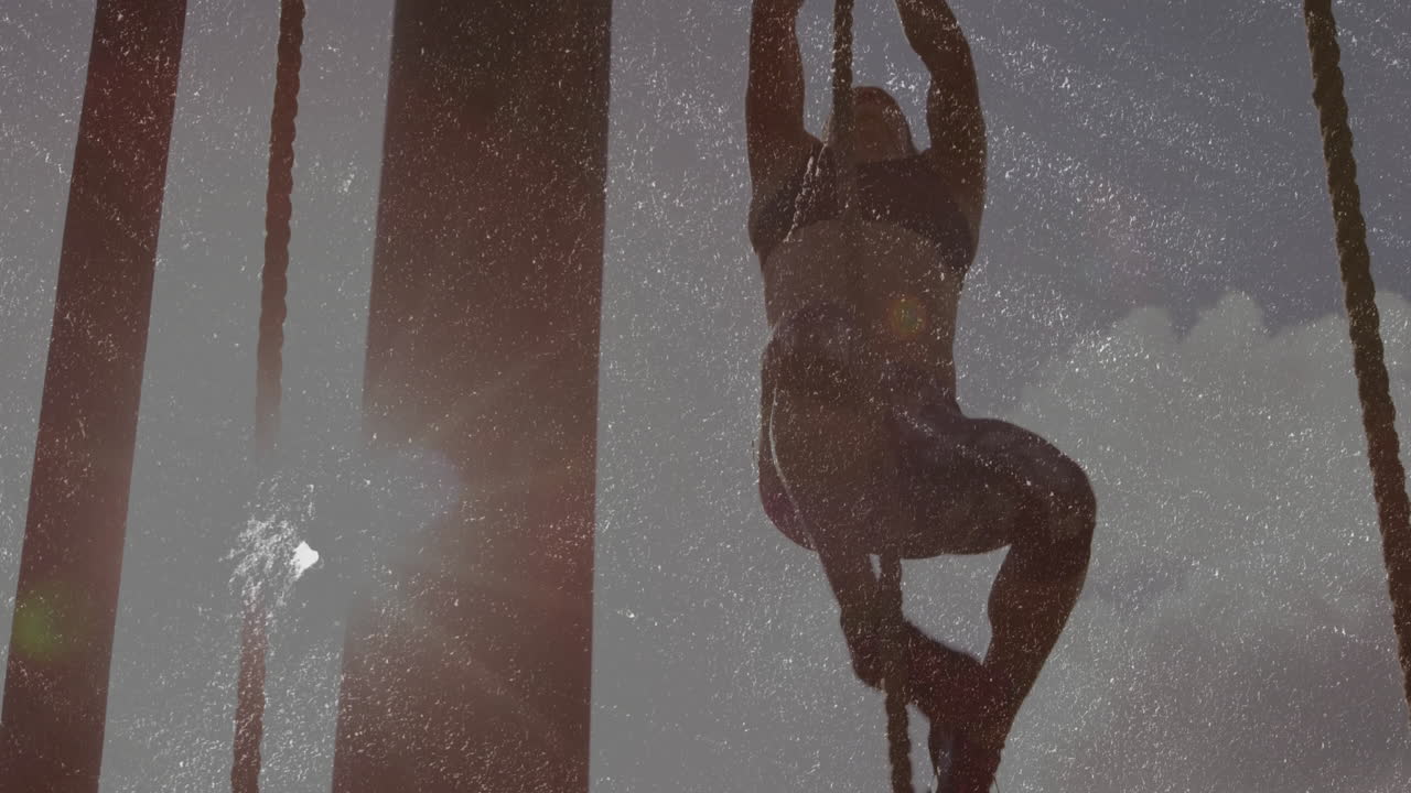Climbing rope with sunlight and dust particles, silhouette of person in animation