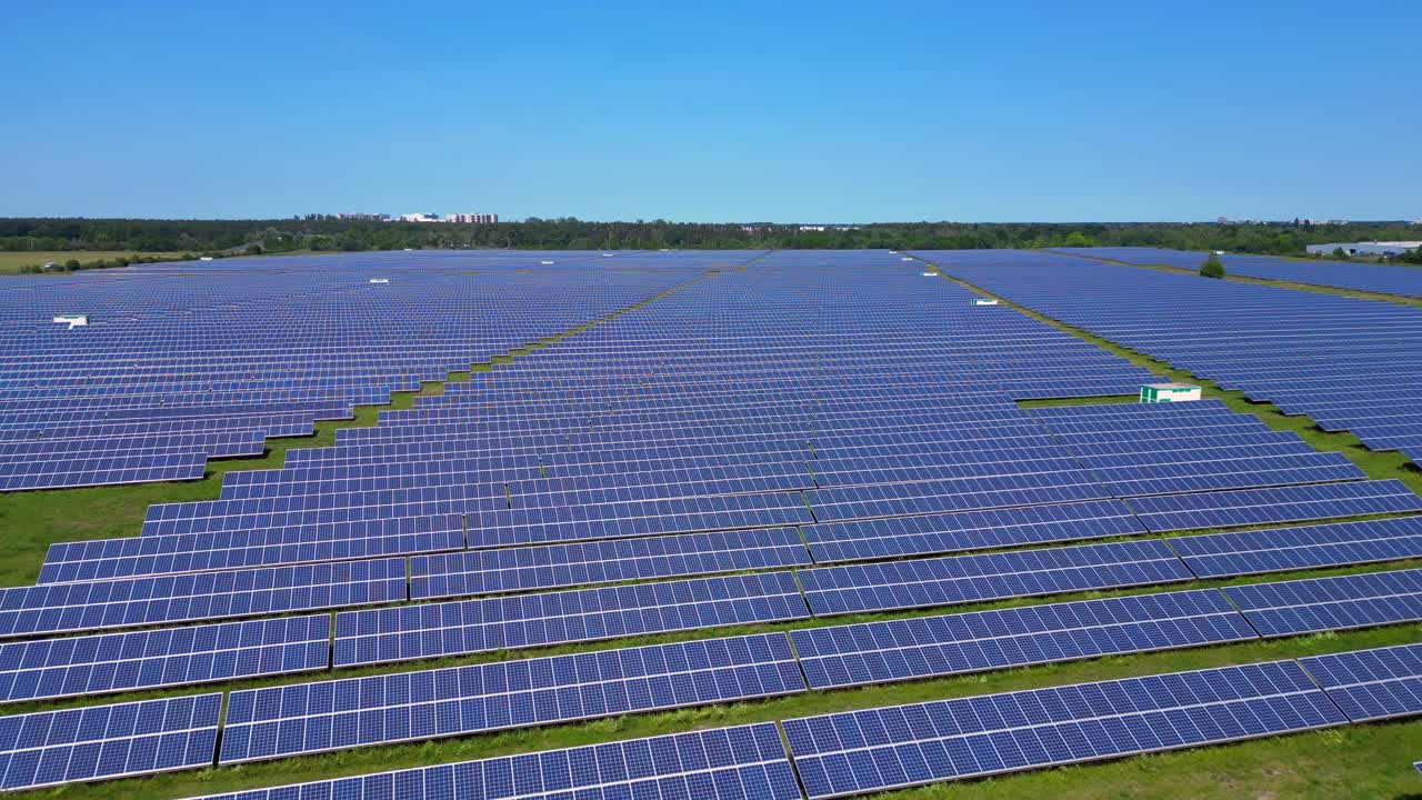 Rows of photovoltaic solar panels are absorbing the sun in a large ...