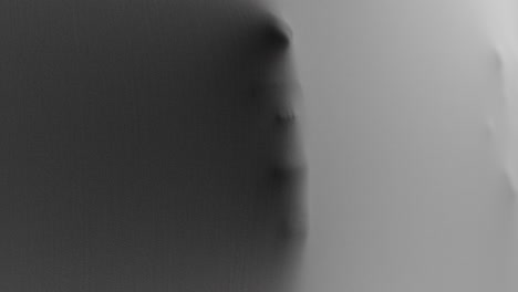 a creepy silhouette of a woman's body appears from the white surface