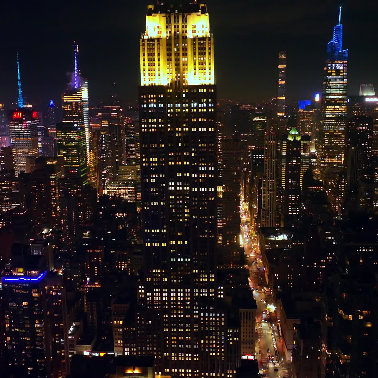 Beautiful skyscraper of Empire State building in New York. Magnificent cityscape of metropolis at night. Top view