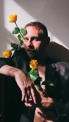 man with yellow roses