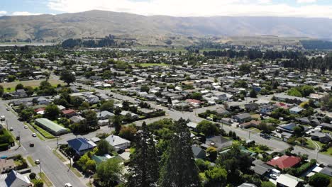 drone aerial view of cromwell, central otago, south island, new zealand, valley town on sunny day