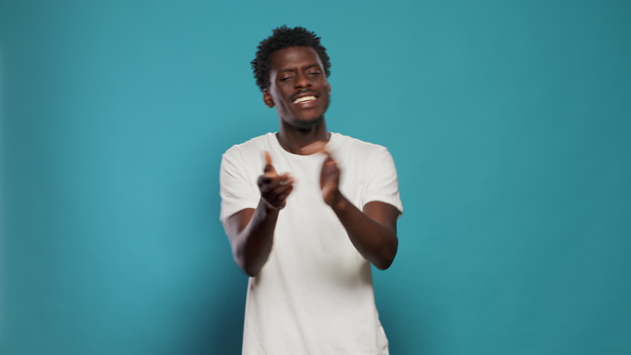 Casual person talking and using hands to applaud in studio