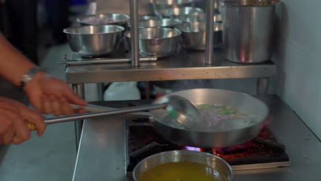 Sauteing-onions-and-shallots-for-a-curry-inside-a-commercial-kitchen