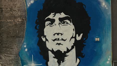 maradona mural tribute on naples street, italy