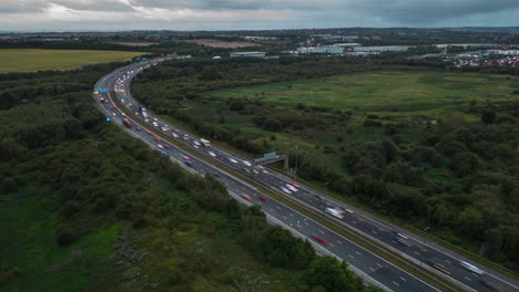 establishing pullback aerial drone hyperlapse of m1 motorway at sunrise near leeds uk