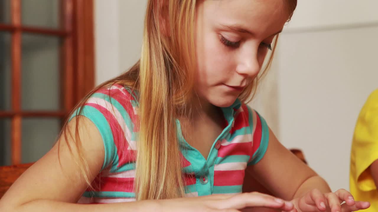 Pupils using tablets with their teacher