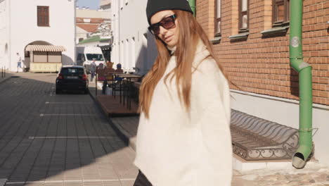 woman in stylish sweater and hat