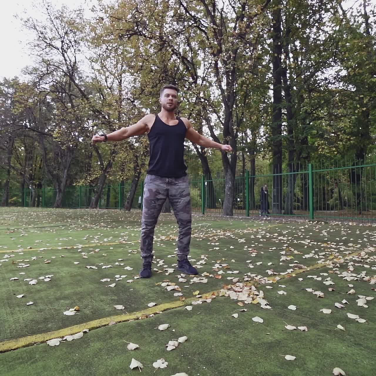 . Sportsman doing exercise. Fit athlete doing exercises at stadium