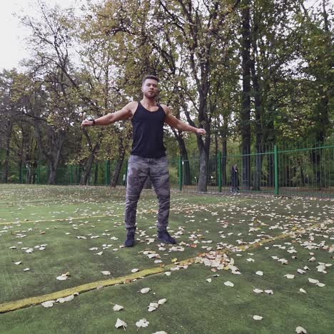 . sportsman doing exercise. fit athlete doing exercises at stadium