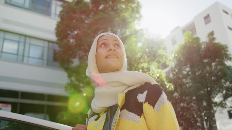 Young woman wearing hijab out and about in the city