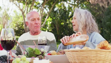 Happy-caucasian-family-having-dinner-in-garden