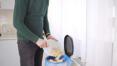 the man throws away the uneaten food at home and does not care.