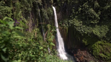 scenic view of the catarata del toro waterfall, showing its powerful cascade plunging into a pool below
