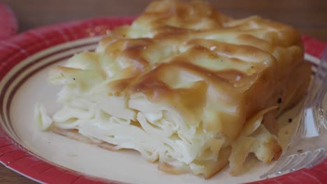 close-up of a savory layered pastry on a plate