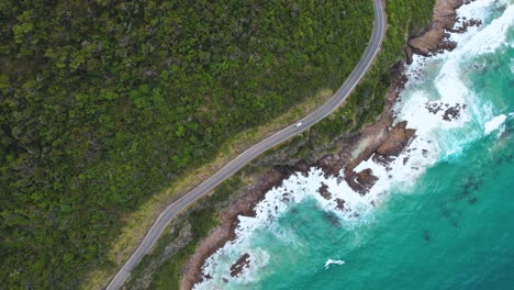 4k drone ariel video of a camper van driving along the great ocean road