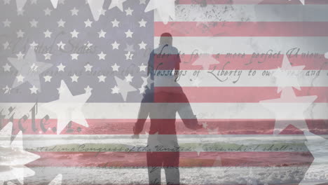 animation of stars and flag of america, rear view of man carrying boy on shoulder at beach