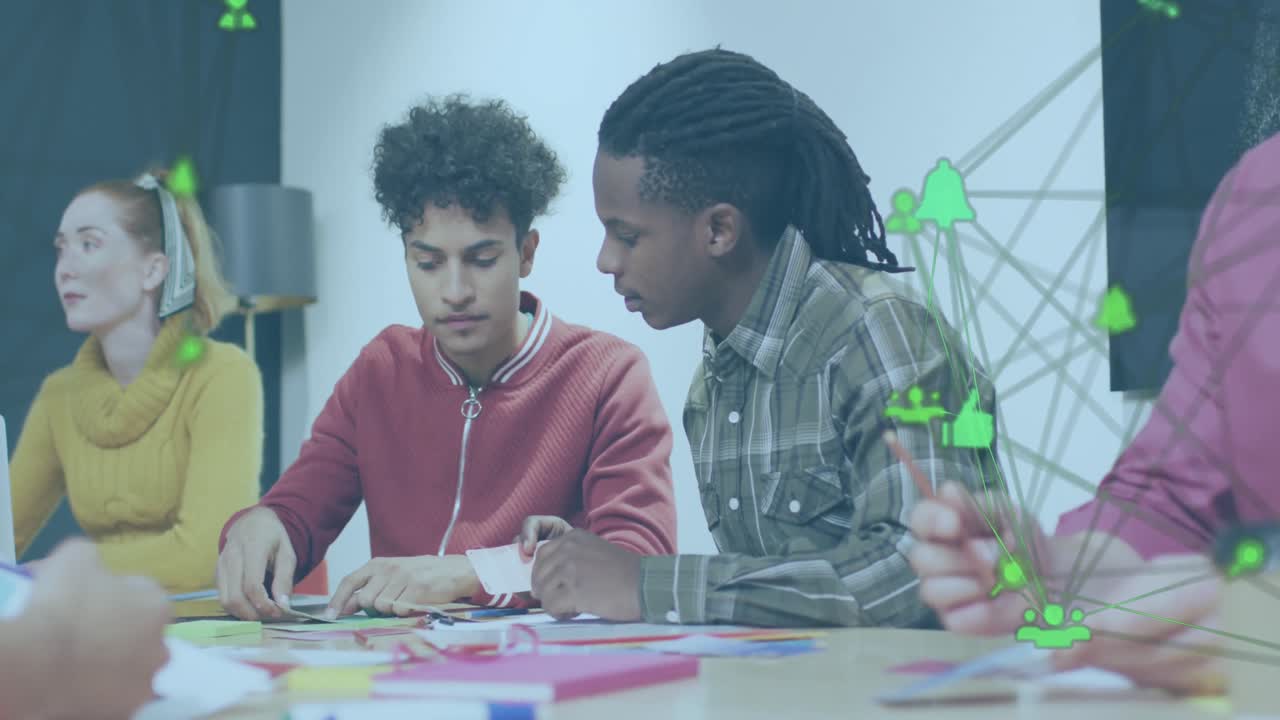 Animation of connected icons forming globe over diverse coworkers sharing ideas in office