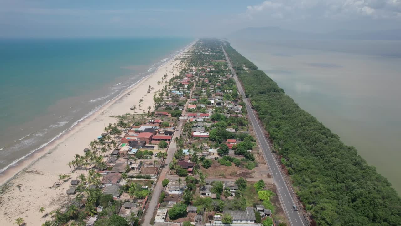 Residential Road on Isthmus of Boca de Uchire Between Sea and Lagoon