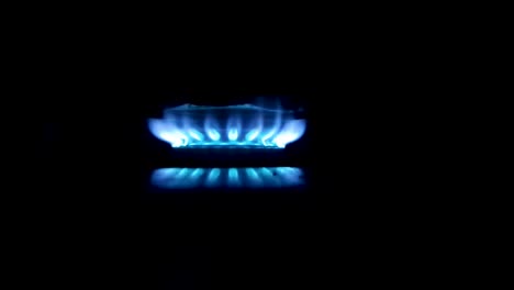 constant blue flame isolated, seen from the side, focused on the center of the screen