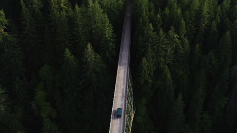 drone shot following a car driving on the high steel bridge, in washington, usa