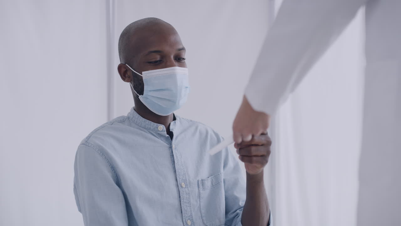 A male doctor taking measures a patient&rsquo;s