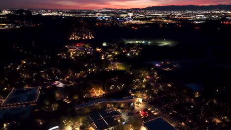 colorful golden hour aerial over desert botanical garden in phoenix, arizona - magical atmosphere at las noches de las luminarias festive event