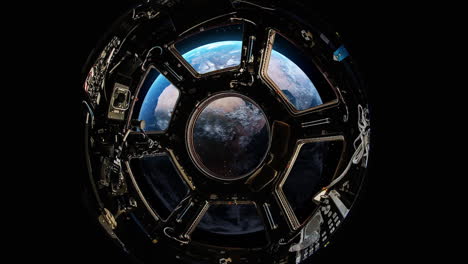 view from a porthole of space station on the earth background