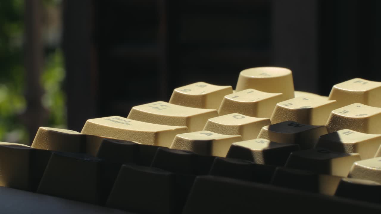 Man working and gaming on retro computer PC, IT engineer with vintage computer at home, using old fashion technology, close up of retro setup.