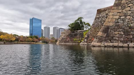 osaka castle and its wall in the mid of autumn