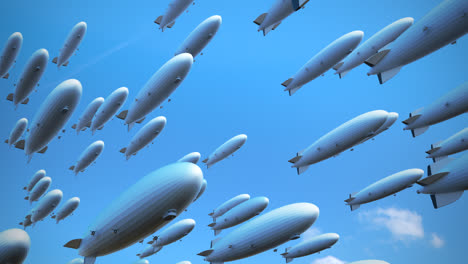 Large-fleet-of-dirigibles.-Many-smooth-shaped-airships-are-flying-diagonally-across-the-frame,-view-from-underneath.-The-blimps-were-used-in-transporting-cargo-and-passengers.