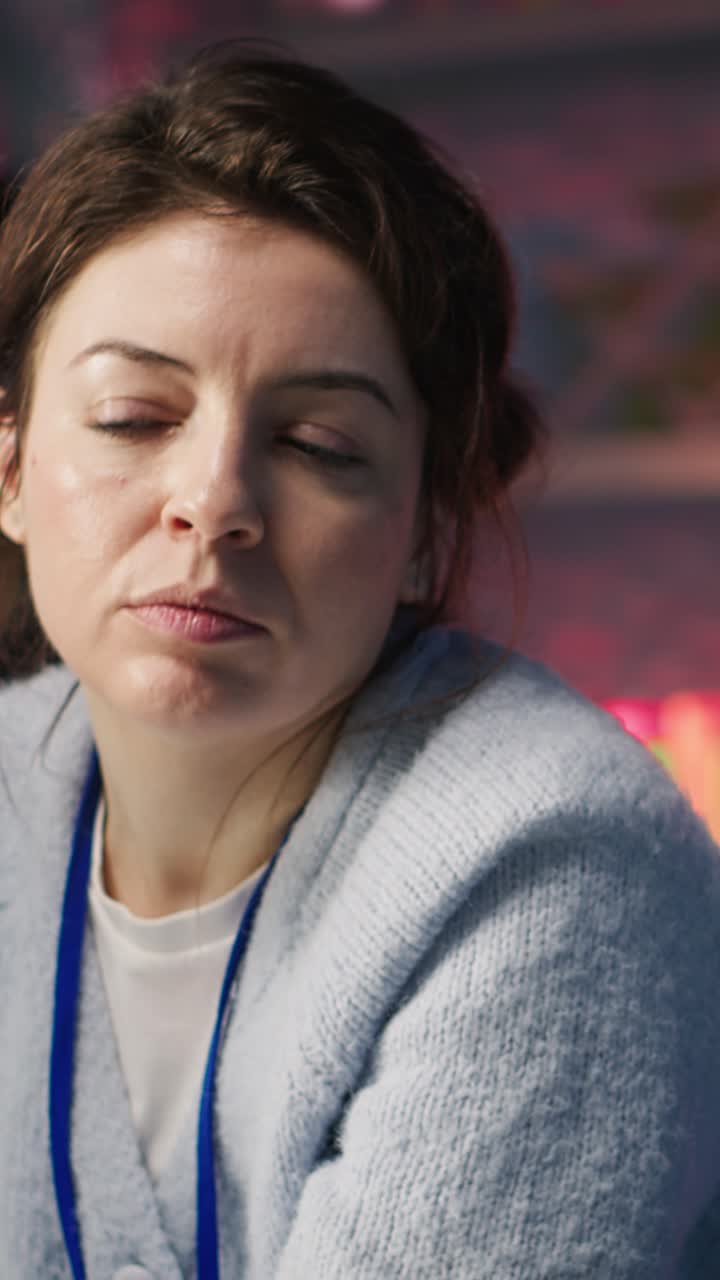 Vertical video Call center onboarding employee providing training to new agent recruit