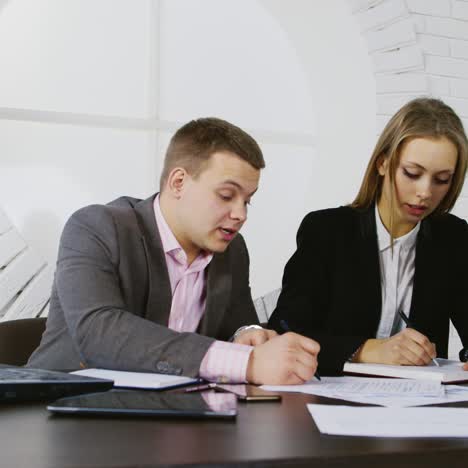 discussion between a young businessman and colleague 02