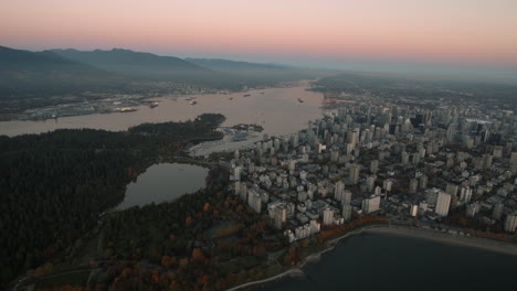 Aerial-wide-shot-of-West-end-Vancouver-and-Stanley-park,-Dusk