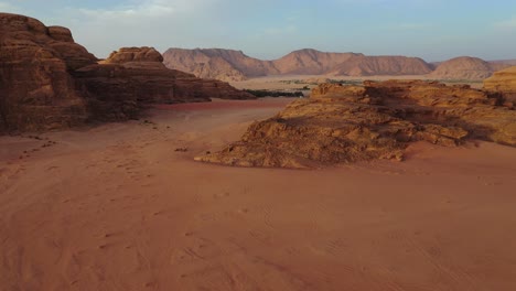 wadi rum rock formation in jordan, aerial pull away