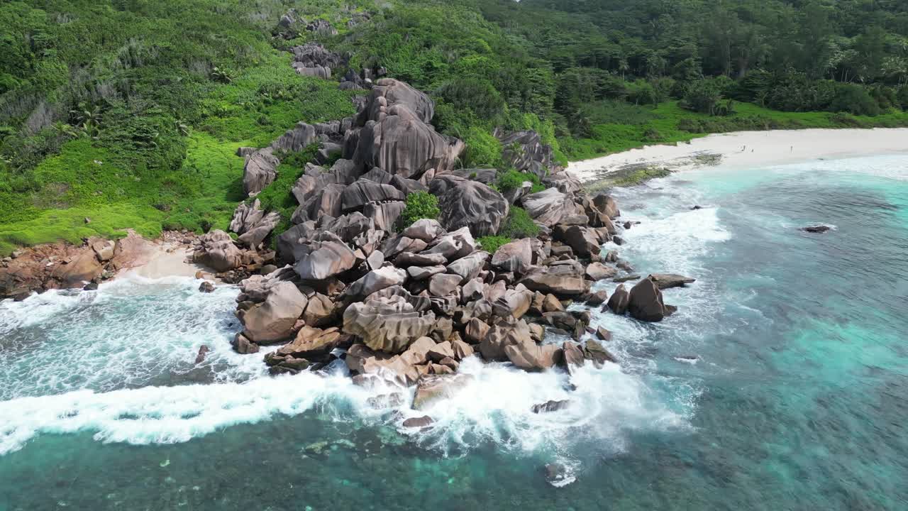 Aerial View of Tropical Beach with Granite Rocks and Turquoise Water