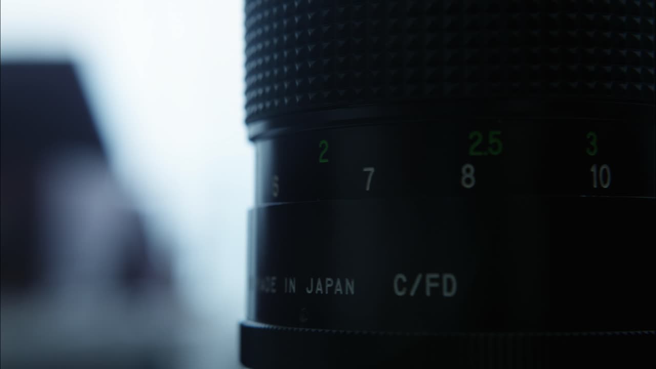 Close-up of Camera Lens Adjusting Focus and Aperture