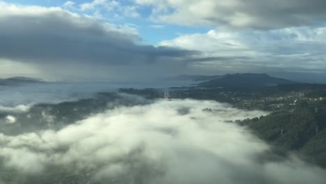 real time approach to a mountanious airport surrounded by patches of fog