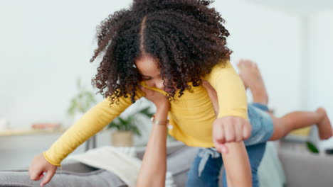 Airplane,-mother-and-daughter-playing-on-a-sofa