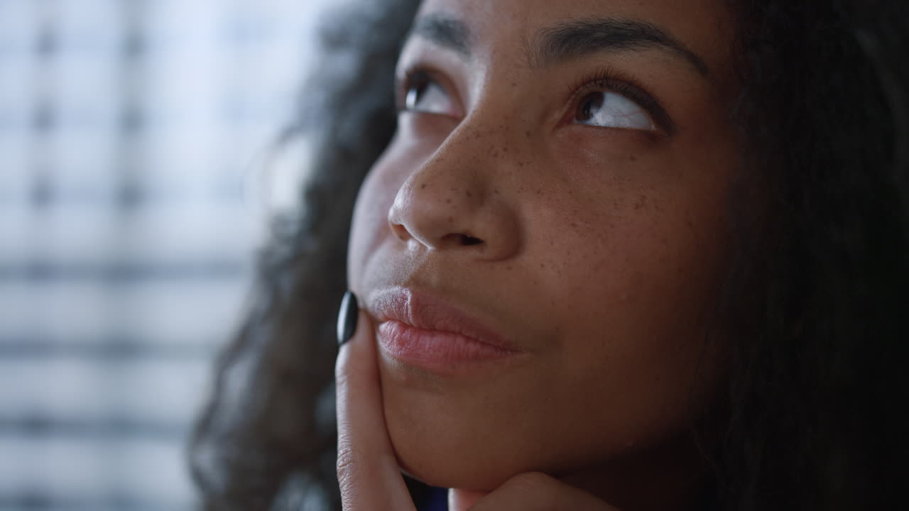 Focused african american businesswoman thinking of creative ideas in office.