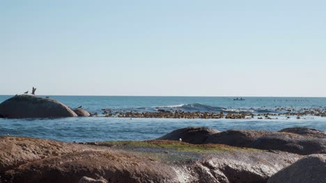 Timelapse of the ocean during daytime with a small fishing boat in the background