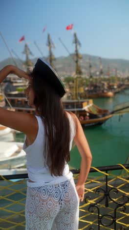 woman and girl in pirate hats enjoying a harbor view