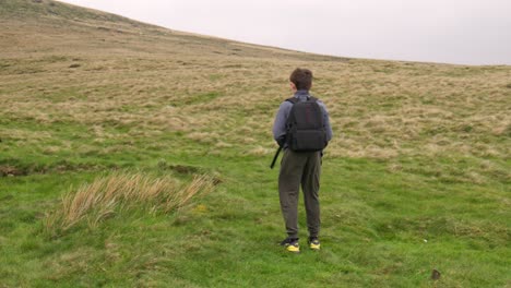 Young-boy-outdoors-on-the-moors-playing-with-his-RC-Car,-Truck,-4-x-4