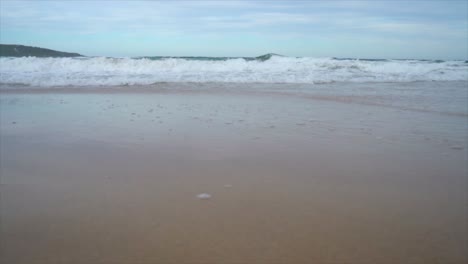 wave come and wash out shooting from low angle