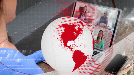 animation of red and white globe rotating over woman making laptop video call with for colleagues